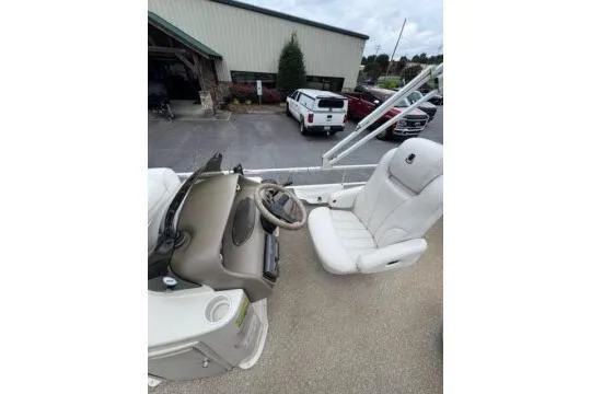 Slide: The Image of 2006 Premier 225 Legend boat interior with steering wheel and captain's chair. - 11