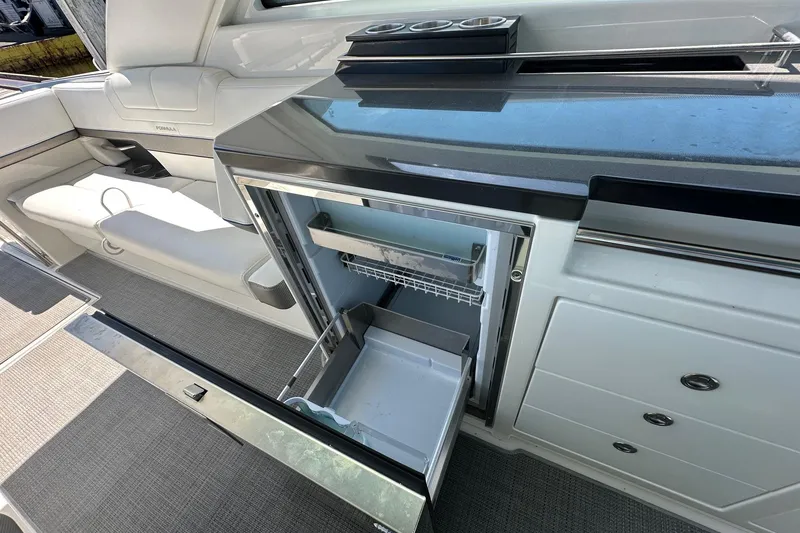 Slide: The Image of 2017 Formula 430 Super Sport Crossover boat on water, featuring four powerful engines. - 11