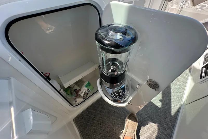 Slide: The Image of 2017 Formula 430 Super Sport Crossover interior with built-in blender and storage compartment. - 35