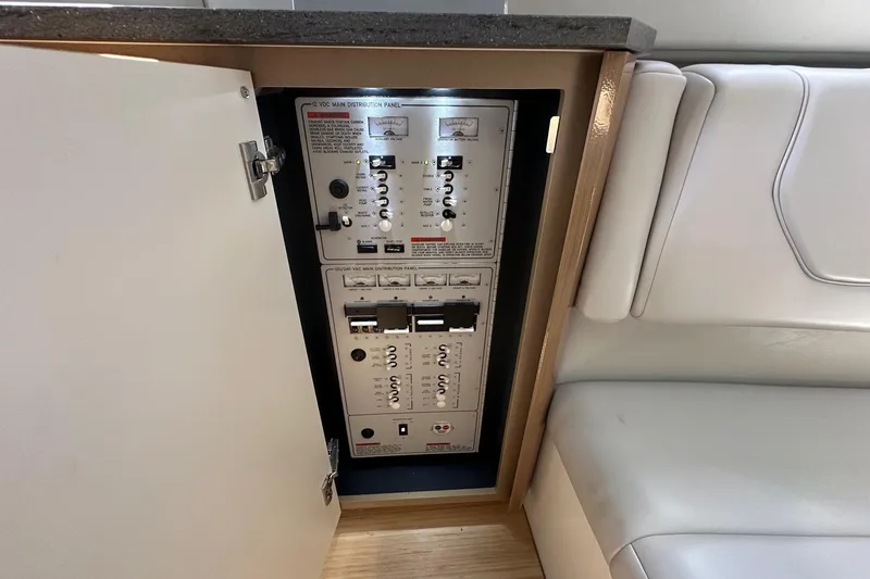 Slide: The Image of Electrical panel inside 2017 Formula 430 Super Sport Crossover boat, featuring control switches and breakers. - 46