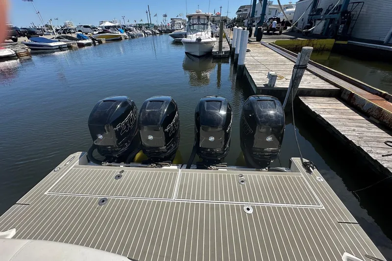 Slide: The Image of 2017 Formula 430 Super Sport Crossover boat on open water, featuring powerful outboard engines. - 5