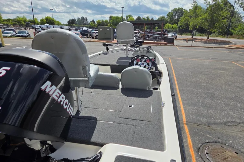 Slide: The Image of 2011 Stratos 186XT boat with Mercury engine in parking lot. - 4