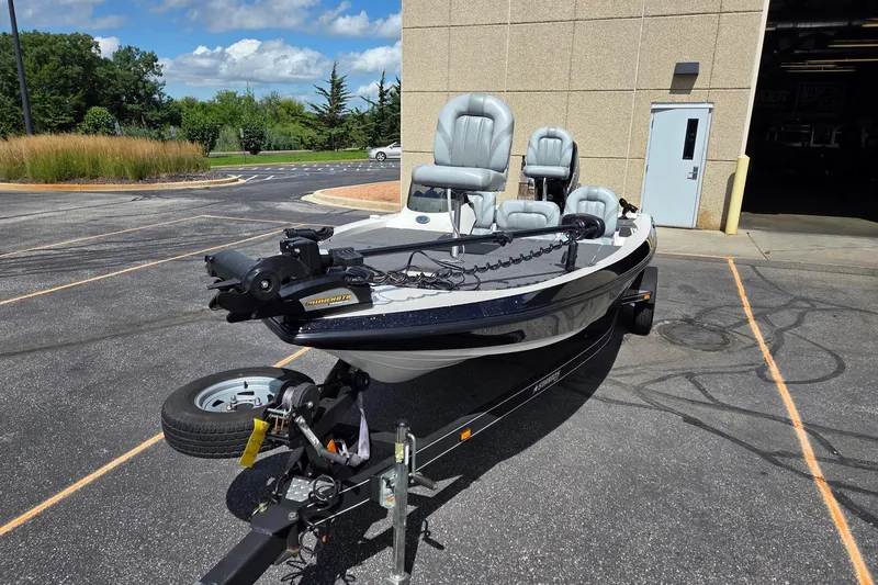 Slide: The Image of 2011 Stratos 186XT boat on trailer in parking lot, sunny day. - 5