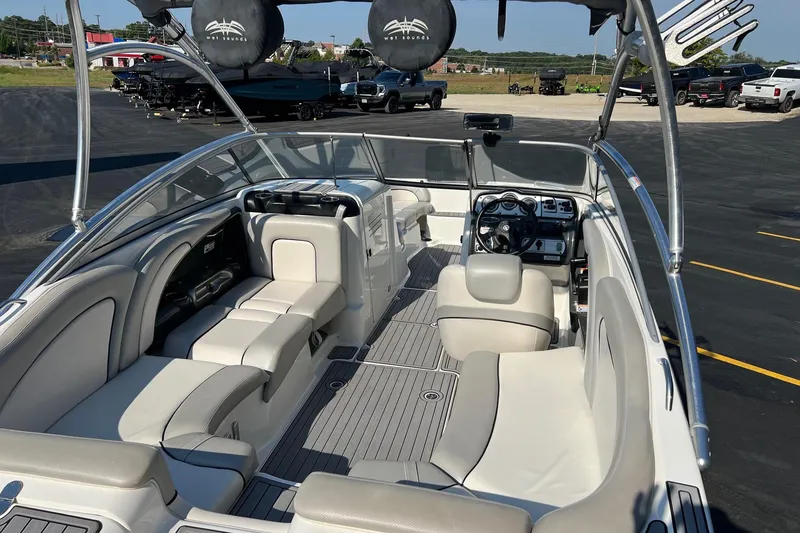 Slide: The Image of 2011 Yamaha Boats AR240 HO interior with spacious seating and modern dashboard. - 10