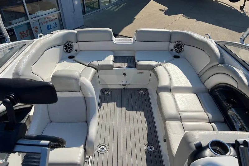Slide: The Image of 2011 Yamaha Boats AR240 HO interior with white seating and gray flooring. - 11