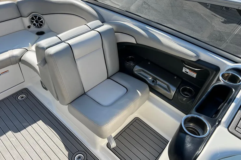 Slide: The Image of 2011 Yamaha Boats AR240 HO interior with seating and cup holders. - 13