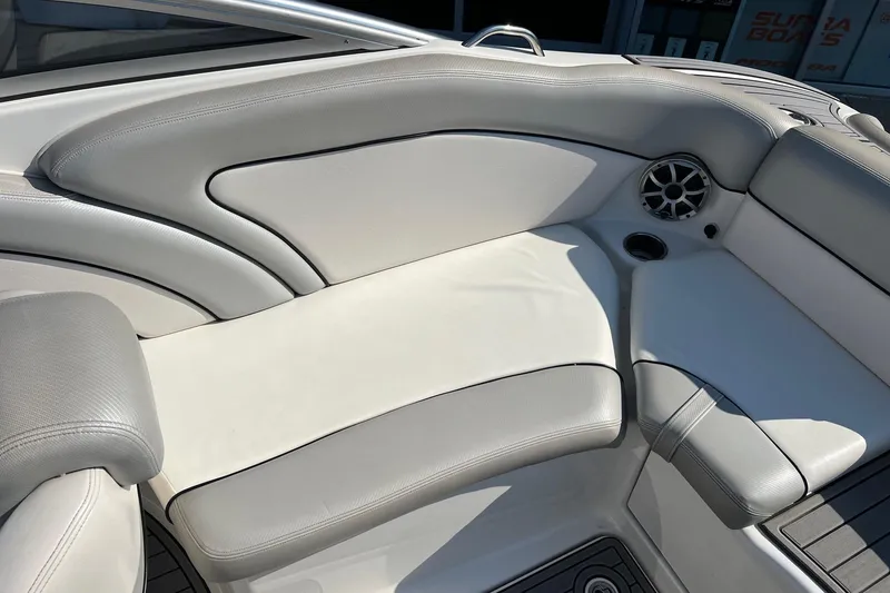 Slide: The Image of 2011 Yamaha Boats AR240 HO interior seating with speaker and cup holder. - 14