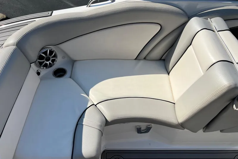 Slide: The Image of 2011 Yamaha Boats AR240 HO interior seating with speaker and cup holder. - 16