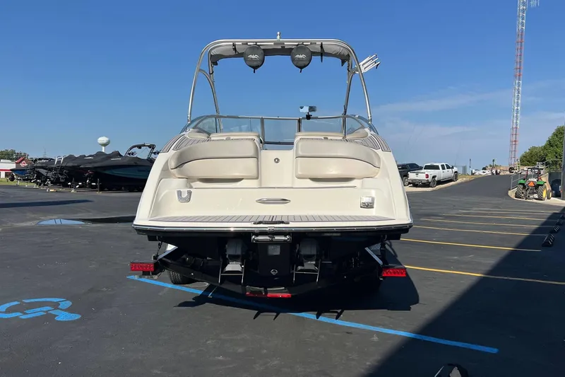 Slide: The Image of 2011 Yamaha Boats AR240 HO in parking lot, rear view, sunny day. - 4