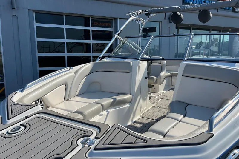 Slide: The Image of 2011 Yamaha Boats AR240 HO interior with sleek seating and modern design. - 9