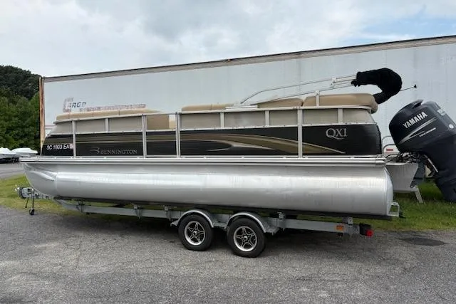 Slide: The Image of 2008 Bennington 2275QXi pontoon boat on trailer with Yamaha outboard motor. - 1