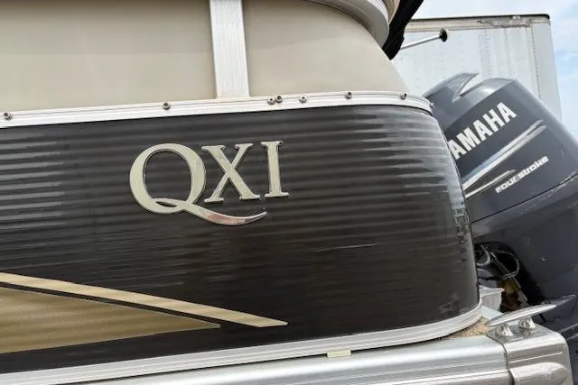Slide: The Image of 2008 Bennington 2275QXi boat with Yamaha engine, close-up of QXi logo. - 11