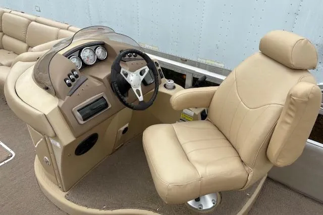 Slide: The Image of Captain's seat and helm of a 2008 Bennington 2275QXi pontoon boat. - 5