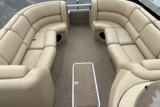 Slide: The Image of 2008 Bennington 2275QXi pontoon boat interior with beige seating and carpeted floor. - 6