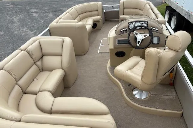 Slide: The Image of 2008 Bennington 2275QXi pontoon boat with beige leather seating and modern dashboard. - 9