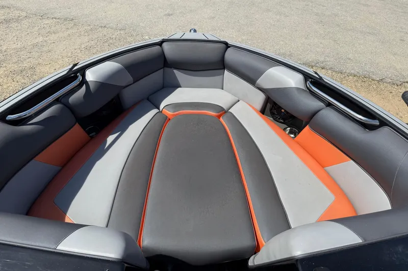 Slide: The Image of 2019 Moomba Craz boat interior with gray and orange seating, showcasing modern design. - 3