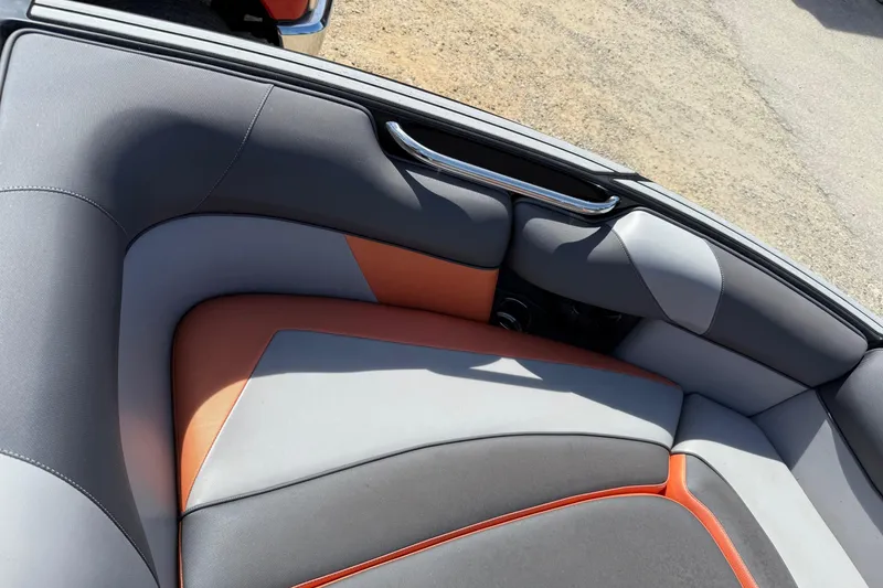 Slide: The Image of 2019 Moomba Craz boat interior with gray and orange seating, featuring sleek design and comfortable upholstery. - 4