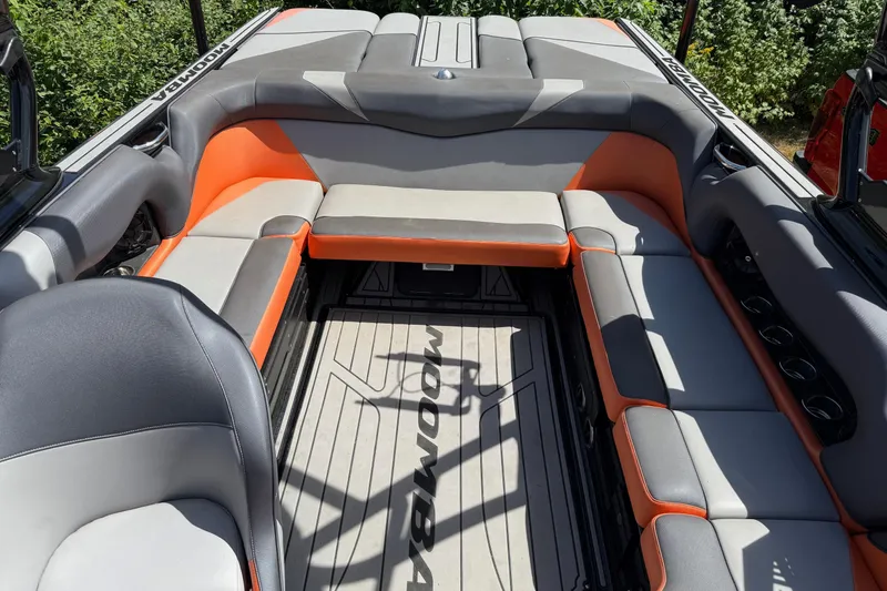 Slide: The Image of 2019 Moomba Craz boat interior with gray and orange seating, spacious layout. - 9