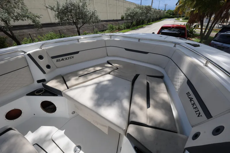 Slide: The Image of 2021 Blackfin 272 CC boat interior with spacious seating and sleek design. - 11