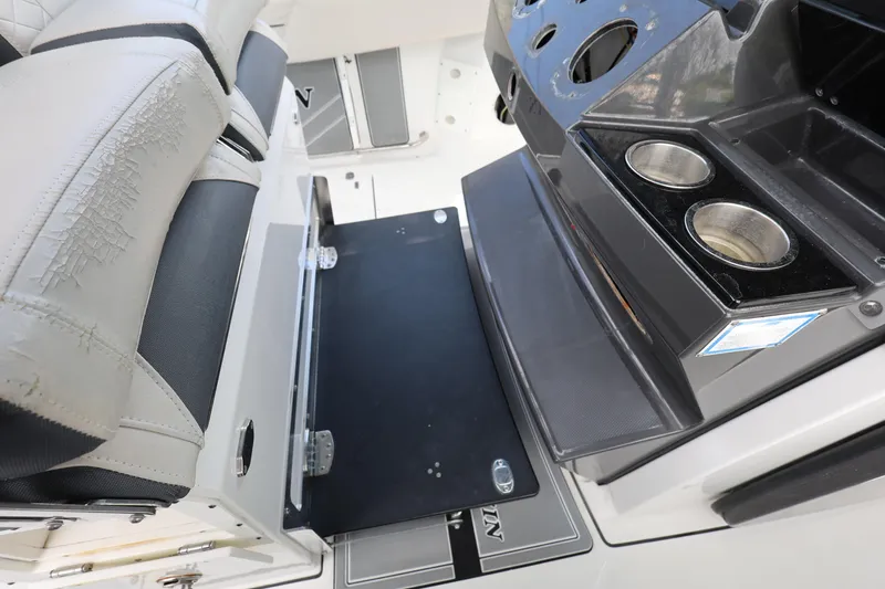 Slide: The Image of 2021 Blackfin 272 CC boat interior with seating and cup holders. - 15