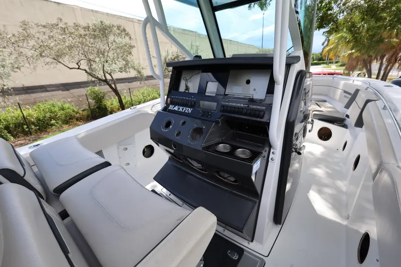 Slide: The Image of 2021 Blackfin 272 CC boat interior with helm station and seating area. - 16