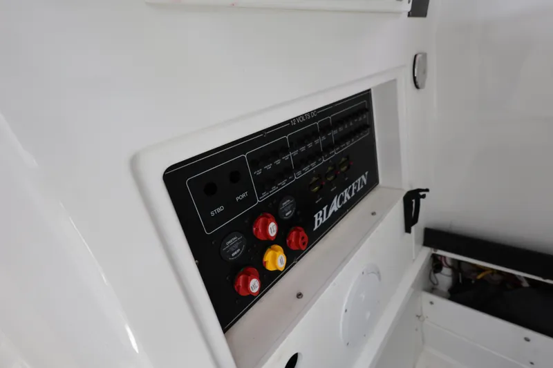 Slide: The Image of 2021 Blackfin 272 CC control panel with switches and labels. - 22
