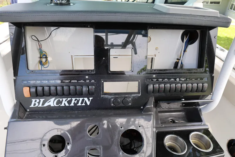 Slide: The Image of Control panel of a 2021 Blackfin 272 CC boat with wiring and switches. - 25