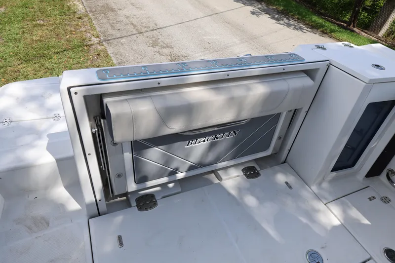 Slide: The Image of 2021 Blackfin 272 CC boat with foldable seat and measuring ruler on deck. - 26