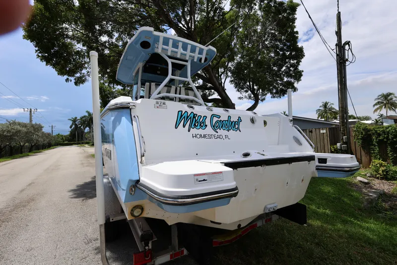 Slide: The Image of 2021 Blackfin 272 CC boat on trailer, parked on a residential street. - 9