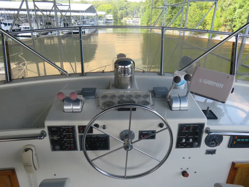 Slide: The Image of 1986 Hatteras 58 Motor Yacht helm with steering wheel and navigation equipment. - 15