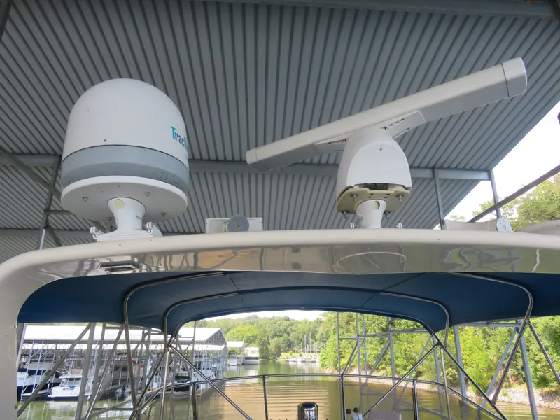 Slide: The Image of Radar and satellite equipment on 1986 Hatteras 58 Motor Yacht under covered dock. - 18