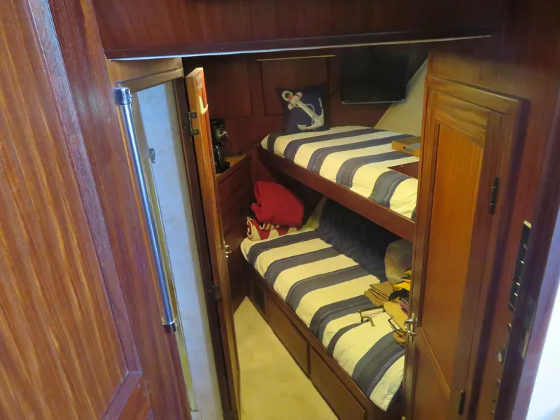 Slide: The Image of Bunk beds in 1986 Hatteras 58 Motor Yacht cabin with nautical decor. - 25