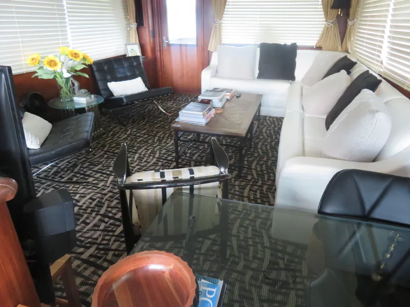 Slide: The Image of Luxurious interior of a 1986 Hatteras 58 Motor Yacht with elegant seating and decor. - 3