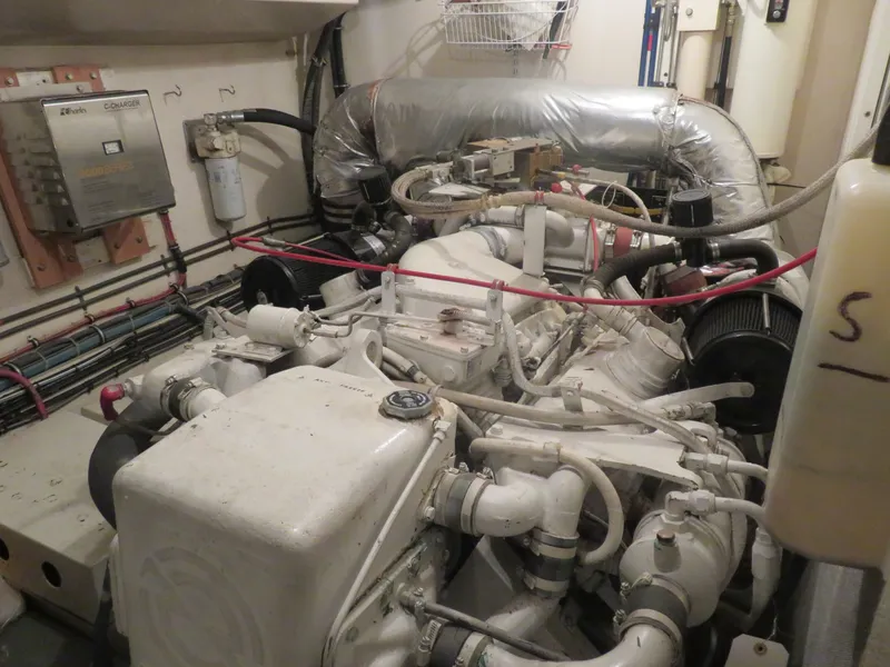 Slide: The Image of Engine room of a 1986 Hatteras 58 Motor Yacht with visible machinery and components. - 40