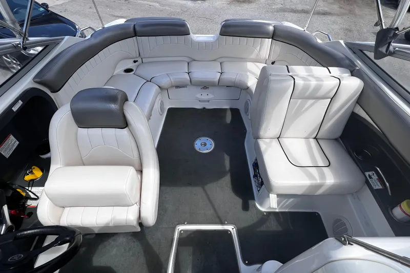 Slide: The Image of 2007 Yamaha Boats AR230 HO interior with white seating and spacious layout. - 4