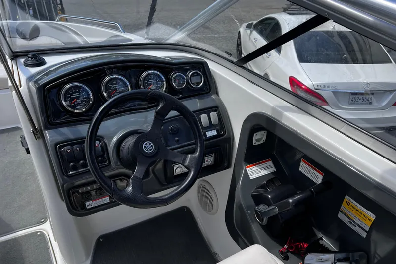 Slide: The Image of 2007 Yamaha Boats AR230 HO dashboard with steering wheel and control panel. - 8