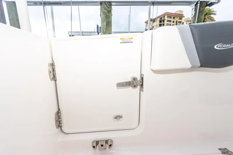 Slide: The Image of 2023 Robalo R250 Center Console boat hatch with secure latch and logo. - 61