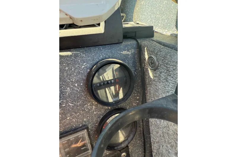 Slide: The Image of Dashboard of a 1991 Fish Rite 22 Custom boat showing gauges and controls. - 18