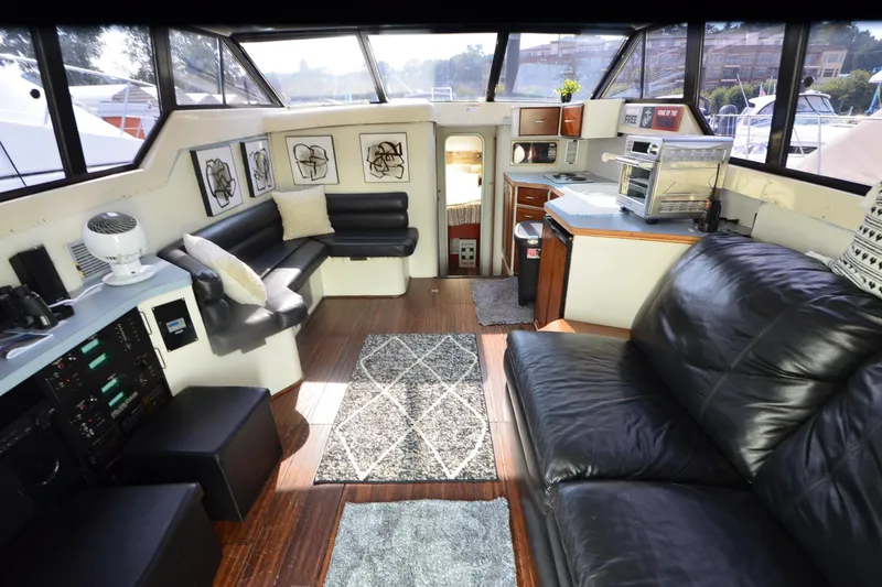 Slide: The Image of Interior of 1988 Mainship Mediterranean Convertible yacht with modern furnishings and decor. - 10