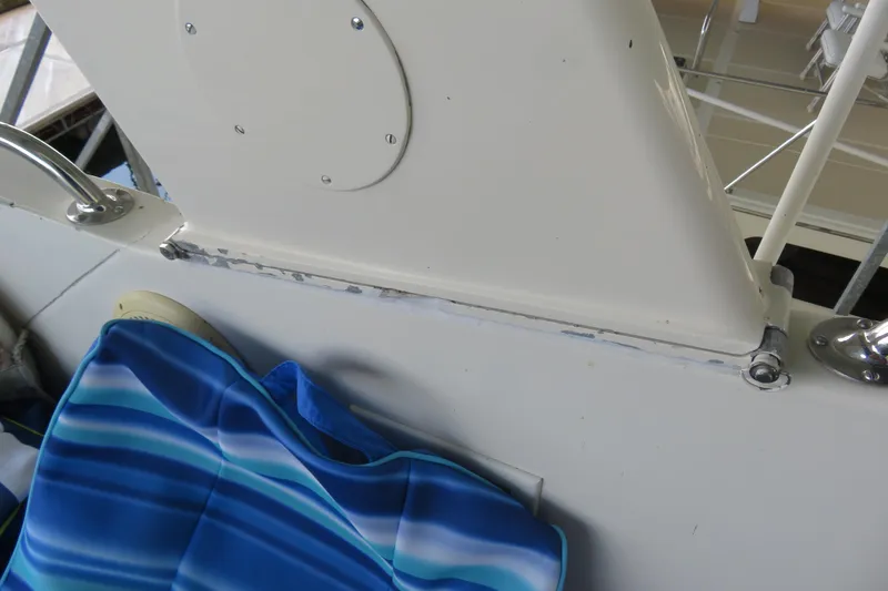 Slide: The Image of 1986 Hatteras 58 Motor Yacht deck detail with blue-striped cushion. - 20