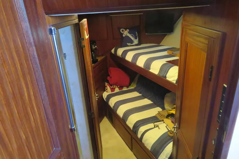 Slide: The Image of Bunk beds in 1986 Hatteras 58 Motor Yacht cabin with nautical decor. - 26