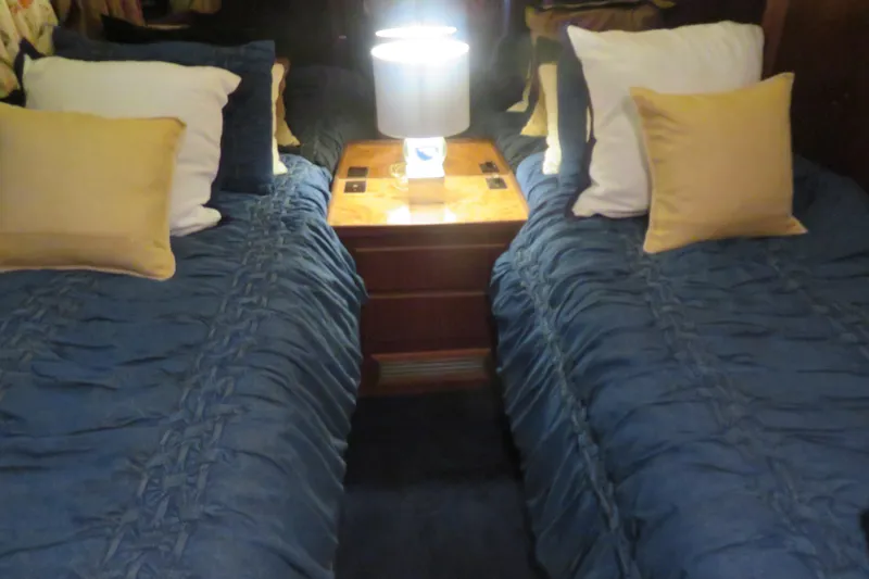 Slide: The Image of Twin beds with blue bedding in 1986 Hatteras 58 Motor Yacht cabin. - 34