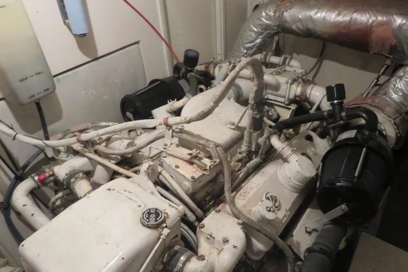 Slide: The Image of Engine room of a 1986 Hatteras 58 Motor Yacht, showcasing mechanical components. - 39