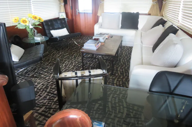 Slide: The Image of Luxurious interior of a 1986 Hatteras 58 Motor Yacht with elegant seating and decor. - 4