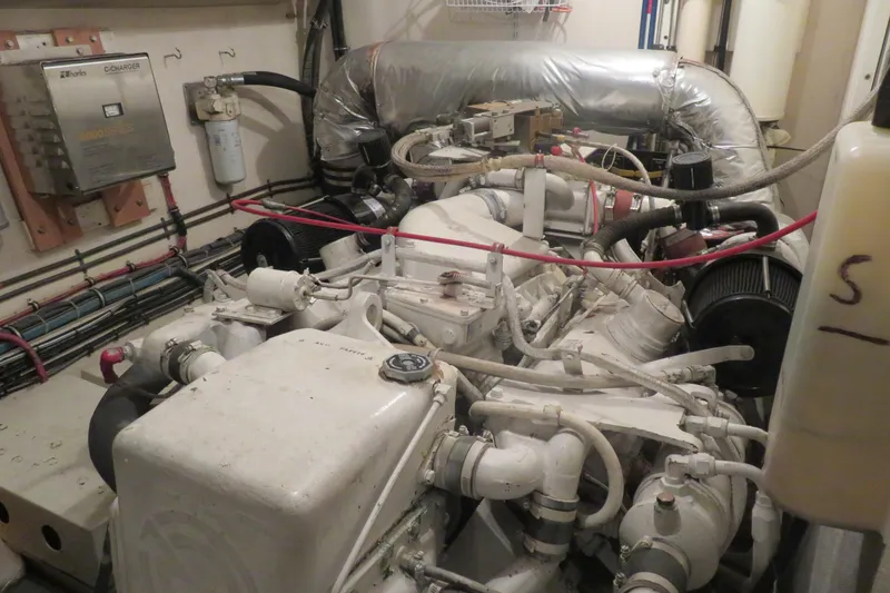 Slide: The Image of Engine room of a 1986 Hatteras 58 Motor Yacht, showcasing mechanical components. - 41