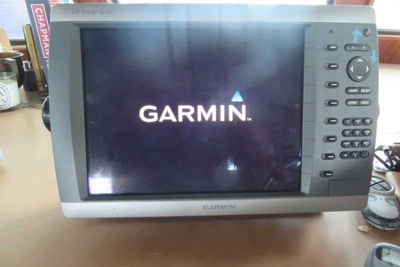Slide: The Image of Garmin GPSmap 4212 device on 1986 Hatteras 58 Motor Yacht dashboard. - 48