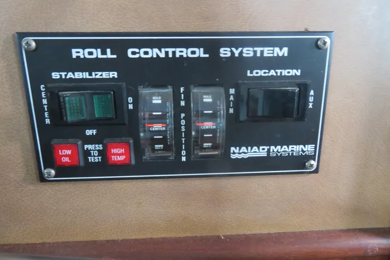 Slide: The Image of Control panel of 1986 Hatteras 58 Motor Yacht's Naiad Marine Systems roll control. - 61