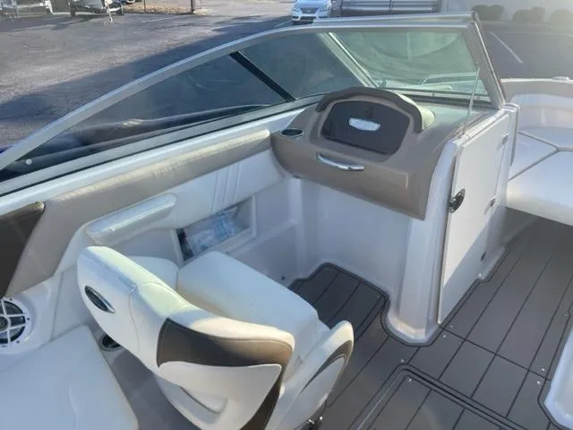 Slide: The Image of 2022 Chaparral 23 SSi boat interior with steering wheel and seating. - 7