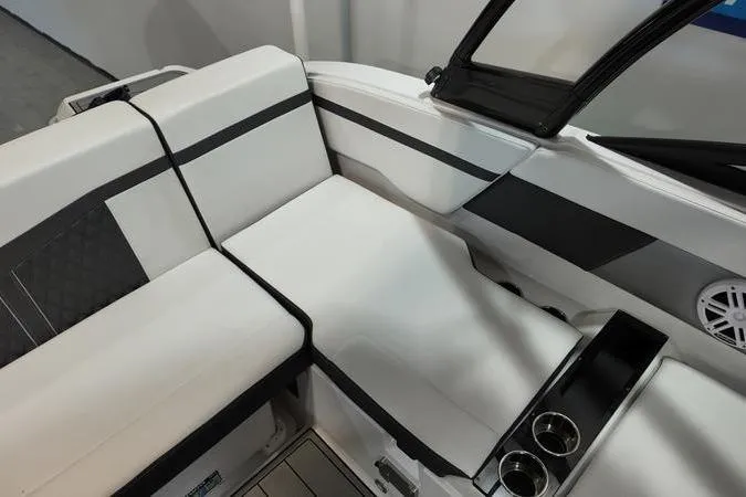 Slide: The Image of 2024 Monterey M-225 boat interior with sleek seating and cup holders. - 12