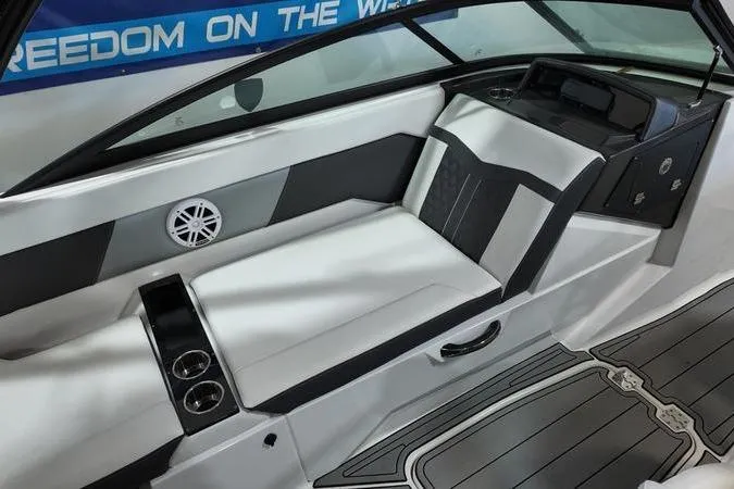 Slide: The Image of 2024 Monterey M-225 boat interior with sleek seating and modern design elements. - 15